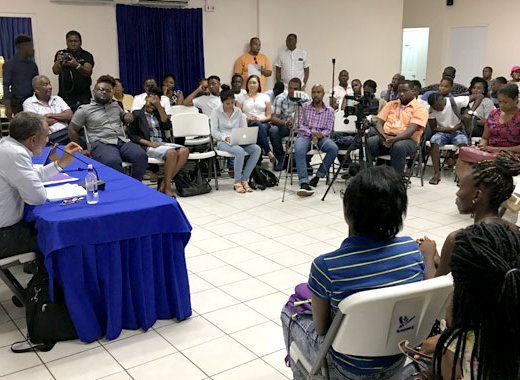Friday in discussion with youth at the event. (iWN photo)
