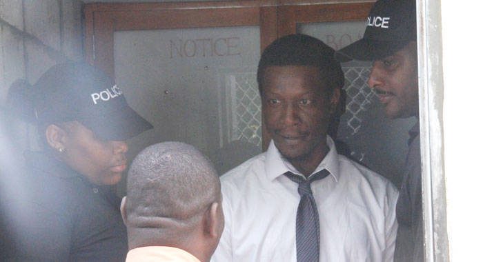 Murder accused Schemel Dunbar leave the Serious Offences Court on Monday. (iWN photo)