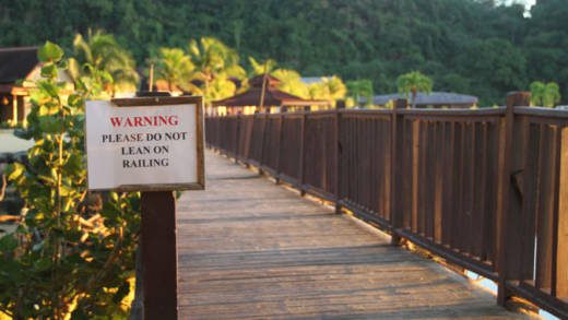 The growth projections are partly hinged on the reopening of Buccament Bay Resort, which has been closed since December 2016. A sign warns beachgoers of the dangers of the crumbling foot bridge at Buccament Bay Resort. The access way had fallen into disrepair after the resort closed on Dec. 14, 2016. (iWN photo)