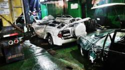 The two vehicles damaged by the fallen fuel tanker. (Photo courtesy Jerry S. George via Facebook)