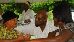 Sen. Carlos James interacts with senior citizens at the luncheon.