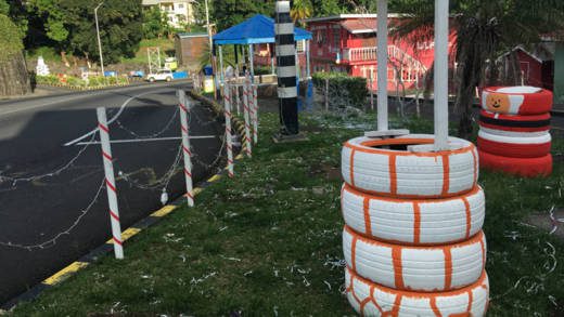 These tyres, used as part of Christmas decorations in Sion Hill, have become breeding grounds for mosquitos. (iWN photo)