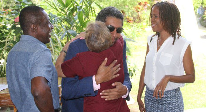 Minister of Finace, Camillo Gonsalves, is greeted on arrival at a Chamber of Industry and Commerce event on Thursday. At right is his wife, Karen Duncan-Gonsalves, while Executive Director of the Chamber, Anthony Regisford is at left. (iWN photo)