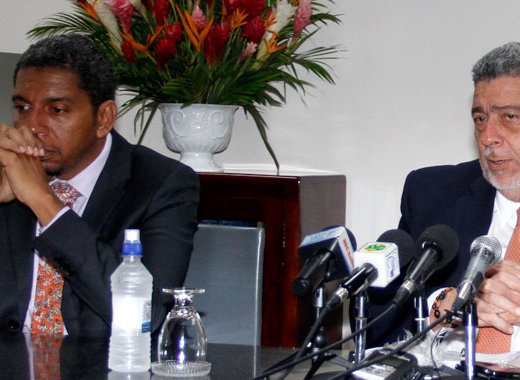Prime Minister Dr. Ralph Gonsalves, right, has been talking about the scandal about which he says he has advised his son and Finance Minister, Camillo Gonsalves, to maintain "a dignified silence". They are seen here at a press conference in September 2017. (iWN file photo)
