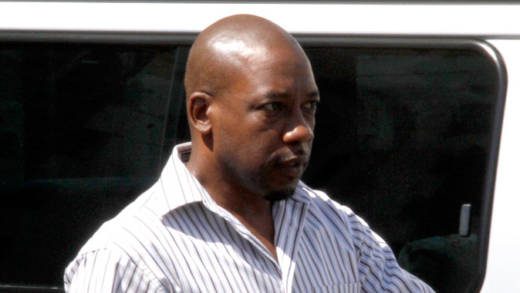 Former journalist Junior Jarvis makes his way back to prison after his arraignment last week. (iWN photo)