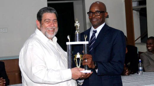 Policeman of the Year 2017, Sergeant Meldon James receives his award from Prime Minister and Minister of National Security, Dr. Ralph Gonsalves. (iWN photo)