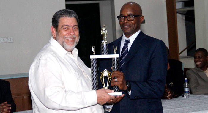 Policeman of the Year 2017, Sergeant Meldon James receives his award from Prime Minister and Minister of National Security, Dr. Ralph Gonsalves. (iWN photo)