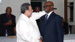Prime Minister Dr. Ralph Gonsalves, left, congraulates Policeman of the Year 2017, Sergeant Meldon James as acting Commissioner of Police, Renold Hadaway looks on at last Thursday's event. (iWN Photo)