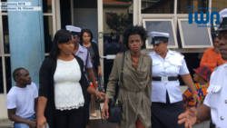 Former model, Yugge Farrel, is escorted from the Kingstown Magistrate Court for transportation to the Mental Health Centre on Monday. (iWN image)