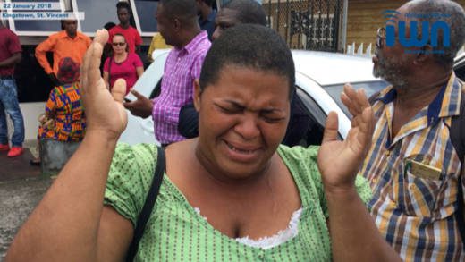 Yugge Farrell's older sister, who did not give her name, cries outside the Kingstown Magistrate's Court on Monday after the former model was taken back to the Mental Health Centre. She told the media her sister was give(iWN image)