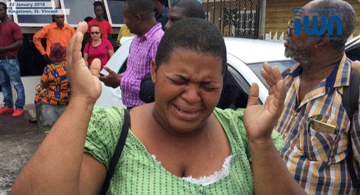 Yugge Farrell's older sister, who did not give her name, cries outside the Kingstown Magistrate's Court on Monday after the former model was taken back to the Mental Health Centre. She told the media her sister was give(iWN image)