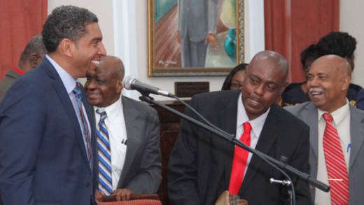 Minister of Finance, Camillo Gonsalves, left, is congratulated by his colleagues after his Budget Address Monday night. (iWN photo)