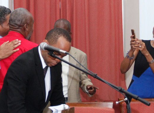 Minister of Finance, Camillo Gonsalves, left, poses with a constituent as his wife, acting FSA Director Karen Duncan-Gonsalves, takes a picture of them after his Budget Address last Monday. (iWN photo) 
