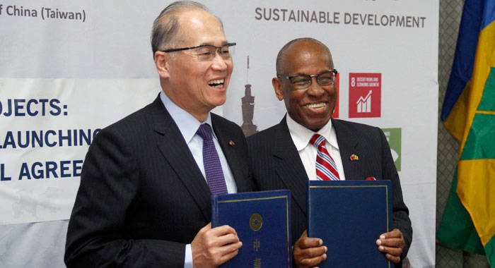 SVG's Minister of Foreign Affairs, Sir Louis Straker, right, and his Taiwan counterpart, David Lee at Thursday's signing ceremony. (iWN photo)