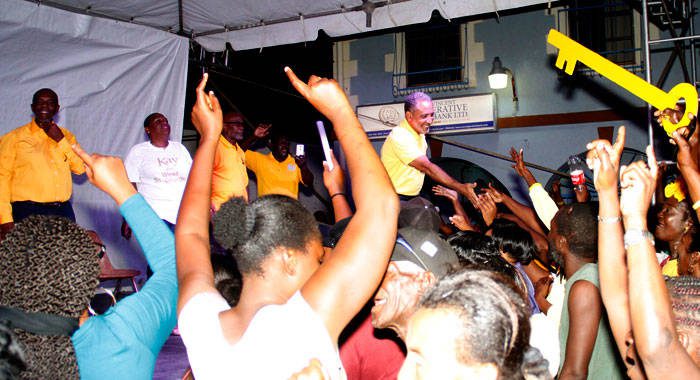 Leader of the opposition and President of the New Democratic Party, Godwin Friday, greet party supporters at the rally in Kingstown. (iWN photo)