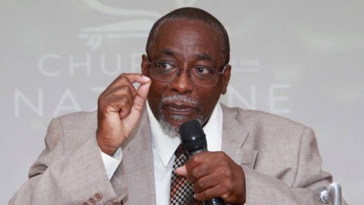 Rev. Joseph Abraham speaks at the Church of the Nazarene service in Arnos Vale on Sunday. (iWN photo)