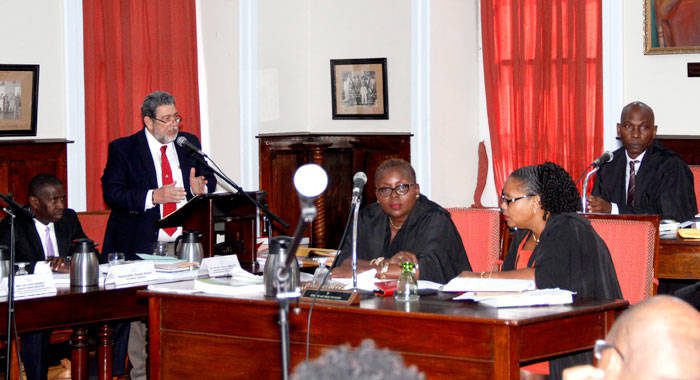 Prime Minister Ralph Gonsalves makes a point in Parliament on Jan. 31. House Speaker Jomo Thomas is furthest right. (iWN photo)