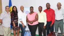 Association of Caribbean MediaWorkers president, Anike Kentish, centre, and her executive. (iWN photo)