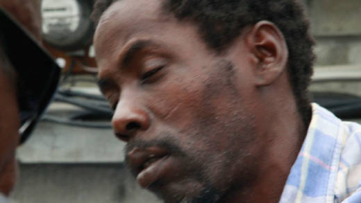 Aaron John on his way to jail on Monday. (iWN photo)