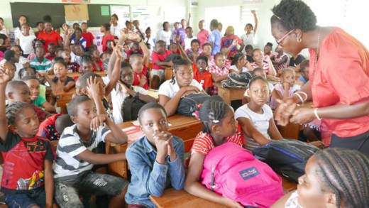 Senior Education Office Joycelyn Blake-Browne discusses climate change with students at Georgetown Government School.