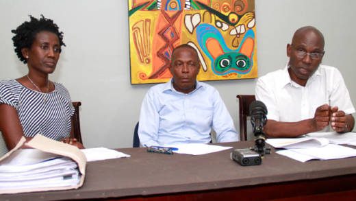 Counsel Sherlan "Zita" Barnwell, left, and Jomo Thomas, right, and their client, Otto Sam, at the press conference on Tuesday. (iWN photo)