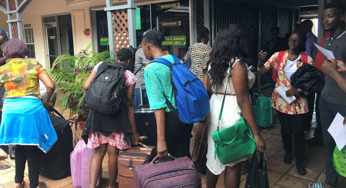All Saints University student prepare to board a ferry from Kingstown to Dominica on Wednesday. (iWN photo)