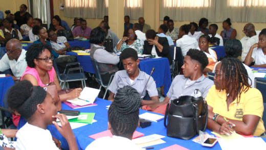 Students and other persons at Wednesdays event. A criminologist says that most youth who stay in school will age out of delinquency by the time they are 17. (iWN photo) 