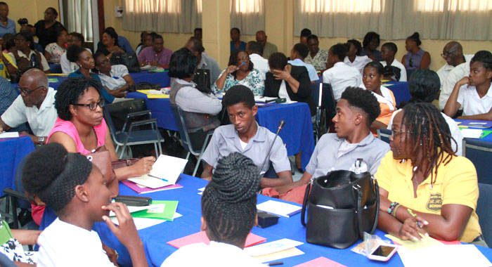 Students and other persons at Wednesdays event. A criminologist says that most youth who stay in school will age out of delinquency by the time they are 17. (iWN photo) 