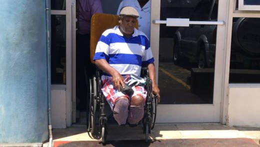 Andrew Myers of Buccament Bay leaves the Kingstown Magistrate's Court in his wheelchair for prison in May 2018. (iWN photo)