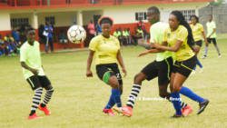 Action in a friendly game between a North Windward XI and the National Senior Women on Tuesday at the Chili Playing Field. (Photo: Robertson Henry)