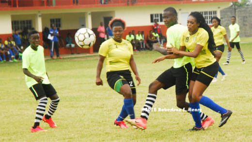 Action in a friendly game between a North Windward XI and the National Senior Women on Tuesday at the Chili Playing Field. (Photo: Robertson Henry)