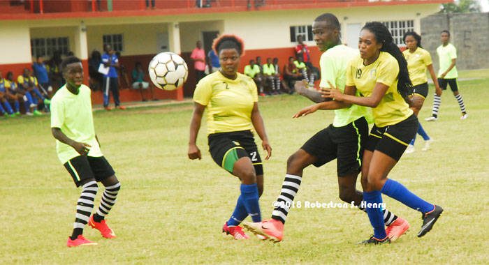 Action in a friendly game between a North Windward XI and the National Senior Women on Tuesday at the Chili Playing Field. (Photo: Robertson Henry)