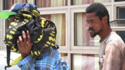 The accused, Jamello Williams, left, and Sheldon Samuel leave the Kingstown Magistrate's Court on Monday. (iWN photo)