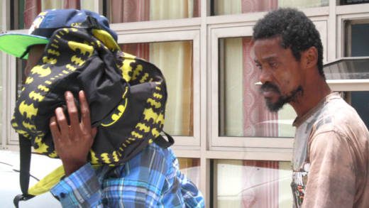 The accused, Jamello Williams, left, and Sheldon Samuel leave the Kingstown Magistrate's Court on Monday. (iWN photo)