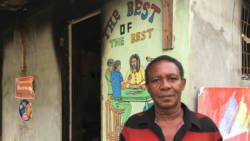 Businessman Rawle Francis stand outside his burnt-out shop in Pierre Hughes, Barrouallie, on June 26, 2018, three days after it was burglarised then set on fire. (iWN photo)