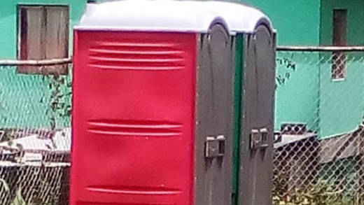The portable toilet, seen in this photo, were removed from the school on Tuesday,  after the NDP learnt that the company had not done so, as agreed. (Photo: Facebook)