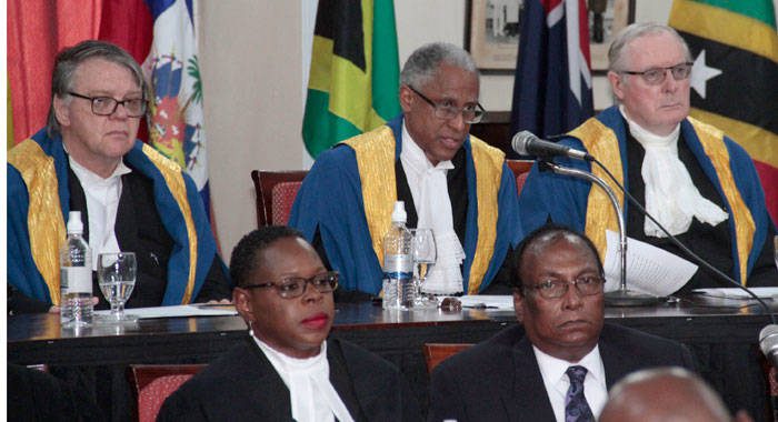 Justice Adrian Saunders speaks at the ceremonial sitting of the Caribbean Court of Justice, of which he is president, in Kingstown, on Friday. (iWN photo)