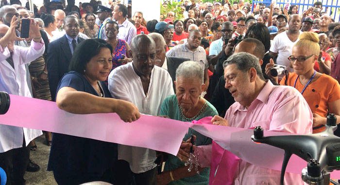 Georgetown resident Myrna Morris, second right, cuts the ribbon to official open the Modern Medical and Diagnostic Centre in Georgetown on Monday, also in photo are, Cuba Ambassador to SVG Vilma Reyes Valdespino, Minister of Social Development, Frederick Stephenson, and Prime Minister Ralph Gonsalves.