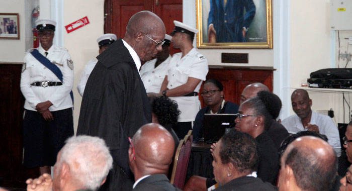 Parnell Campbell, QC, said on Friday that he took it personal when voter rejected proposed changes to the constitution in 2009. 
 He is seen here returning to his seat, after speaking at Friday's ceremonial sitting, in Kingstown, of the Caribbean Court of Justice. (iWN photo). 