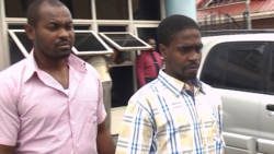 A detective escorts Kesean  Cain, left, after his court appearance last week Monday. He has been charged with Layne's murder.