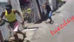 In this screenshot taken from video circulated on social media, one of the suspected gays tries to escape as a man pursues him with a club in Calliaqua on the weekend.