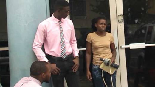 Natasha Allen, right, leaves the Kingstown Magistrates Court on Monday, as two detectives look on. 