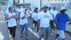 Member of Parliament for North Leeward, Roland "Patel" Matthews, second right, and other persons during the walk last Saturday. 