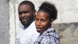 Ashieka Lyttle and an unidentified man leave the Kingstown Magistrate's Court after Monday's proceedings. (iWN photo)