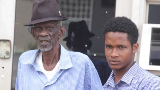 Caspar Haywood, left, and his grandson, Zachary Haywood, leave the Kingstown Magistrate's Court on Tuesday after the proceedings. (iWN photo)