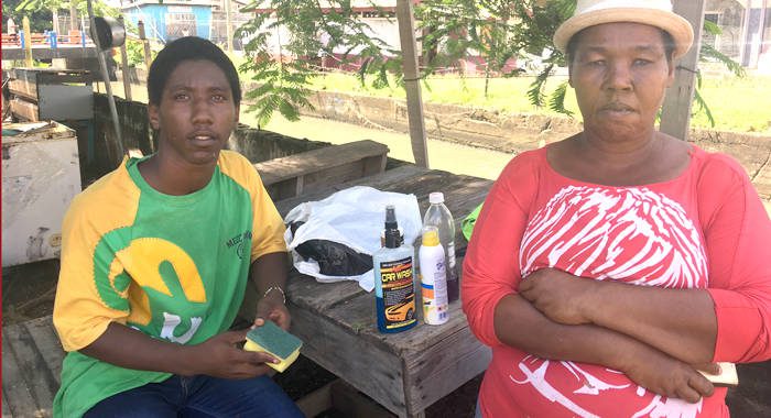 After living n the streets for four months, Inola Hayne and her children have a roof over their heads. She is seen her with her 18-year-old son, Junior Haynes, who is balancing studies with trying to make a living washing cars in Kingstown. (iWN photo) 