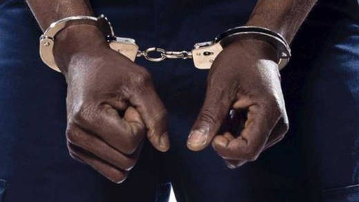 An internet photo of a man in handcuffs.