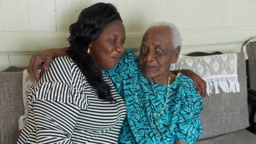 Centenarian Olive Comas,left, and her granddaughter and caretaker, Michelle Williams. 