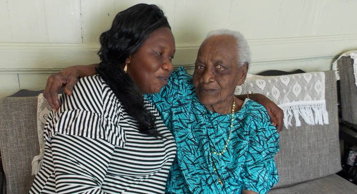 Centenarian Olive Comas,left, and her granddaughter and caretaker, Michelle Williams. 