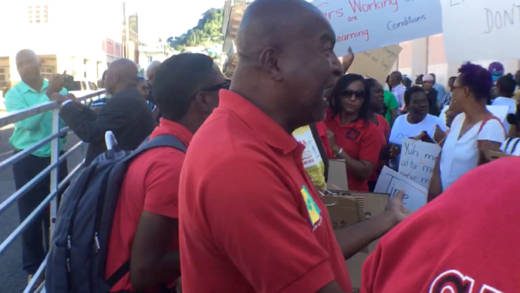 Former president of the SVG Teachers' Union, Oswald Robinson rally protesters in Kingstown on Tuesday. (iWN photo) 
